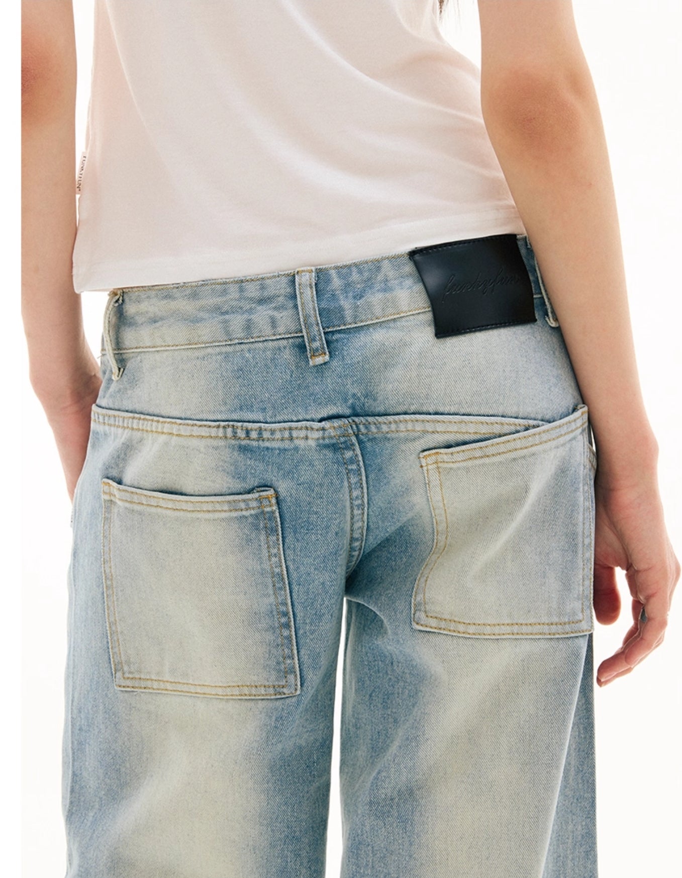 SLANT BREASTED LOW RISE JEANS