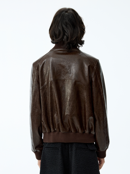 SMOCKED HEM OILED LEATHER JACKET