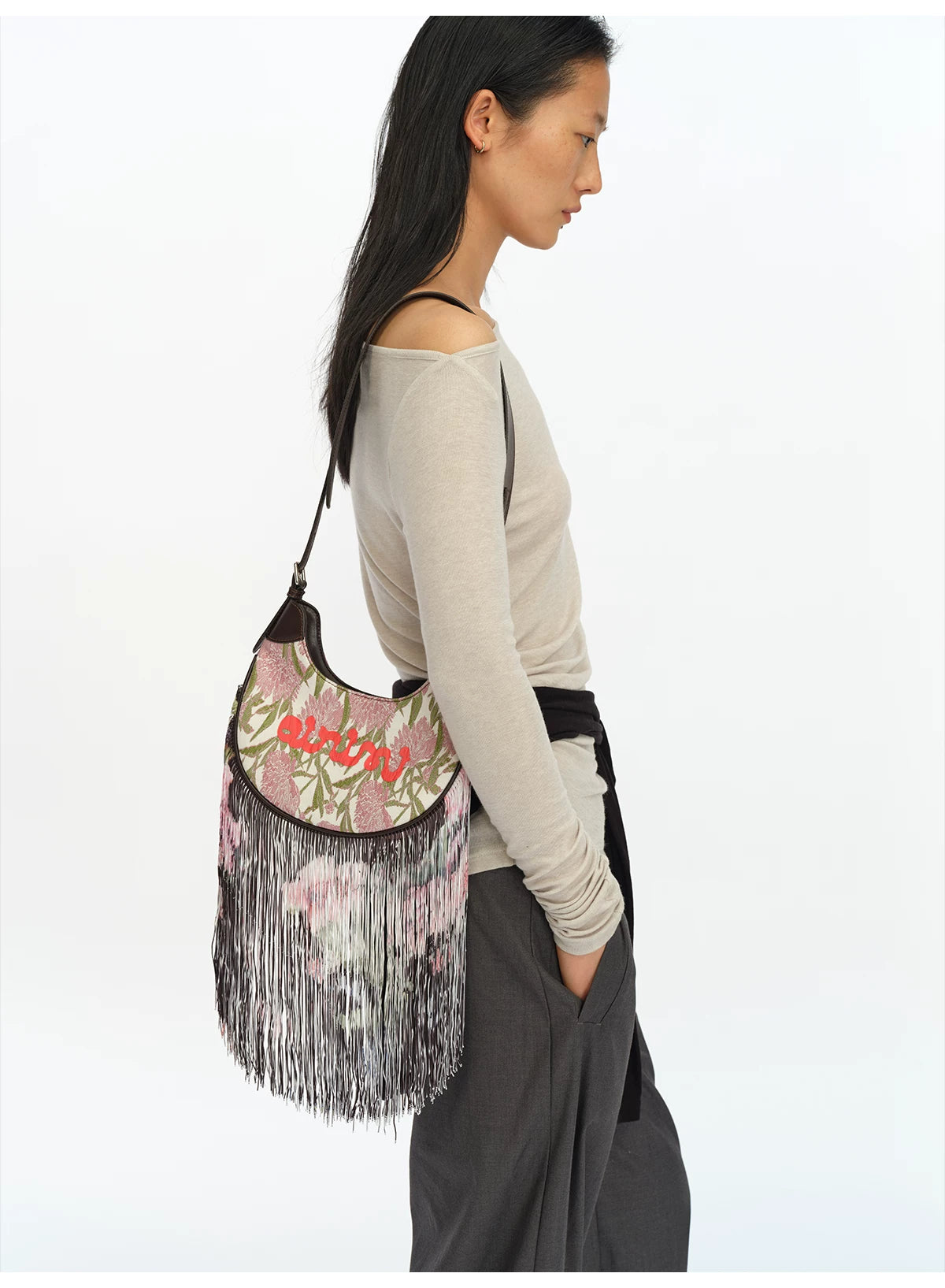 JACQUARD TASSEL MINI SADDLE BAG